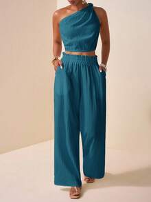 Veslaya 2025秋季新款加大码女装，适合音乐节、复活节、母亲节、西部风、游牧风、生日派对、毕业典礼、学生装、日常休闲、百搭基础款、休闲、度假、邮轮旅行、海滩、日光浴、爆款、优雅、通勤、商务休闲等场合。单肩、扭结、露肩、露背、短款女式上衣搭配直筒宽松裤，饰有荷叶边、口袋和纹理面料，白色。这款两件套女装秋季套装，包含两件套裤装，适合秋季穿着。 - 藍色 - 查看 8