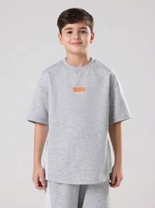 SUMWON Ensemble deux pièces pour pré-adolescents, Sweat-shirt-shirt gris chiné et jogging à larges jambes avec bloc de couleurs et imprimé logo orange. Tenue d'automne et d'hiver