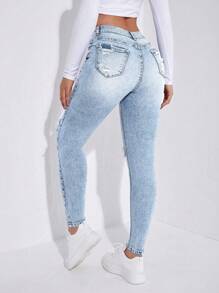 破洞紧身牛仔裤