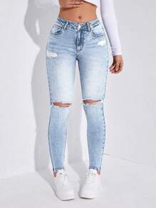 破洞紧身牛仔裤