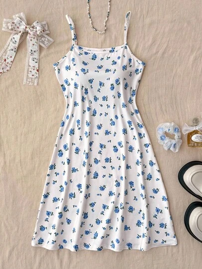 SHEIN Teen Girls White Knitted Blue Small Floral Casual Cute Suspender Dress, Suitable For Home Leisure Blue Floral Dress Blue And White Floral Dress Summer Dress Tween Dress Teen Dress Blue Flower Dress Summer Teen Dress Girls Floral Dress Teen Floral Dress Girls Dress Blue Floral Mini Dress White Sundress With Blue Flowers Girls Blue Floral Dress