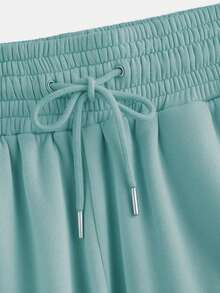 EURMUSE Women's Spring Fashionable Drawstring Solid Grey Sports Cuffs Running Puffy Joggers With Pockets - Mint Green - View 4