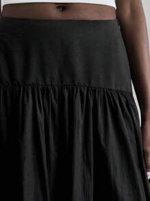 Ontre Chân váy xếp ly cạp cao 2026SS dành cho nữ, chất liệu mềm mại và thoải mái, phù hợp cho đi làm, công sở và mặc hàng ngày. Chân váy dài xếp ly cạp chun màu trơn dành cho nữ, kiểu dáng công sở thường ngày. - màu đen - Xem 7