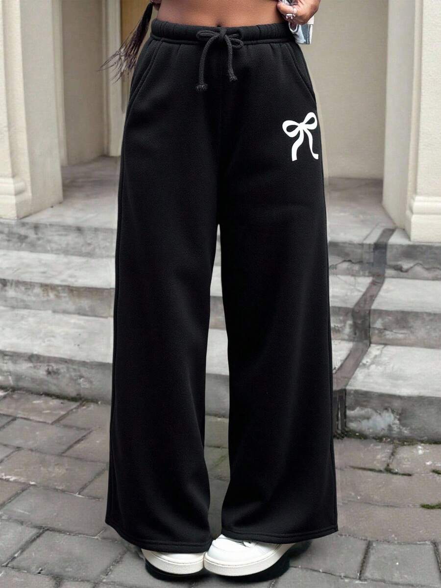 SHEIN 青少年女孩蝴蝶结印花黑色休闲运动裤,时尚百搭,宽松舒适,适合日常穿着的长裤 - 黑色 - 查看 1