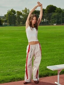 TypaGal These Wide-Leg Track Pants Bring Throwback Energy. With Bold Red Stripes And Print, They're Perfect For 2000s-Style Fall. - Multicolor - View 9