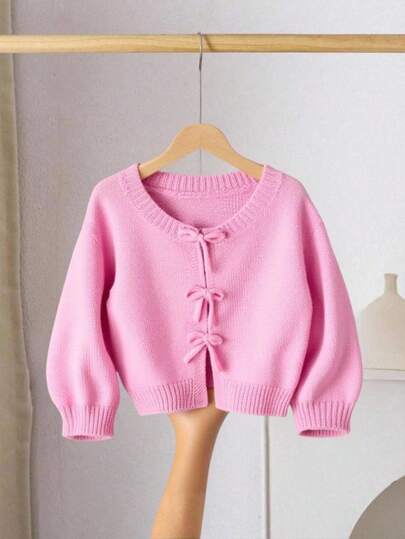 SHEIN LMoss Kids Suéter de malha para meninas, com decoração de laço, fofo e casual, macio e confortável, versátil, adequado para casa, festa, férias