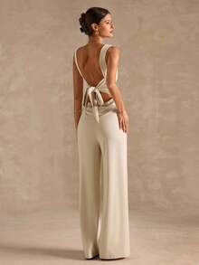 SHEIN BAE Bộ đồ liền thân ống rộng dây mảnh màu đen thanh lịch gợi cảm dành cho nữ với thiết kế nơ hở lưng, thích hợp mặc hàng ngày, hẹn hò, đi chơi, tiệc tùng, tụ tập, trang phục nhiều lớp thanh lịch dành cho nữ, trang phục đi chơi, ngày lễ tình nhân, thường ngày, thanh lịch, đi nghỉ - Màu be - Xem 2