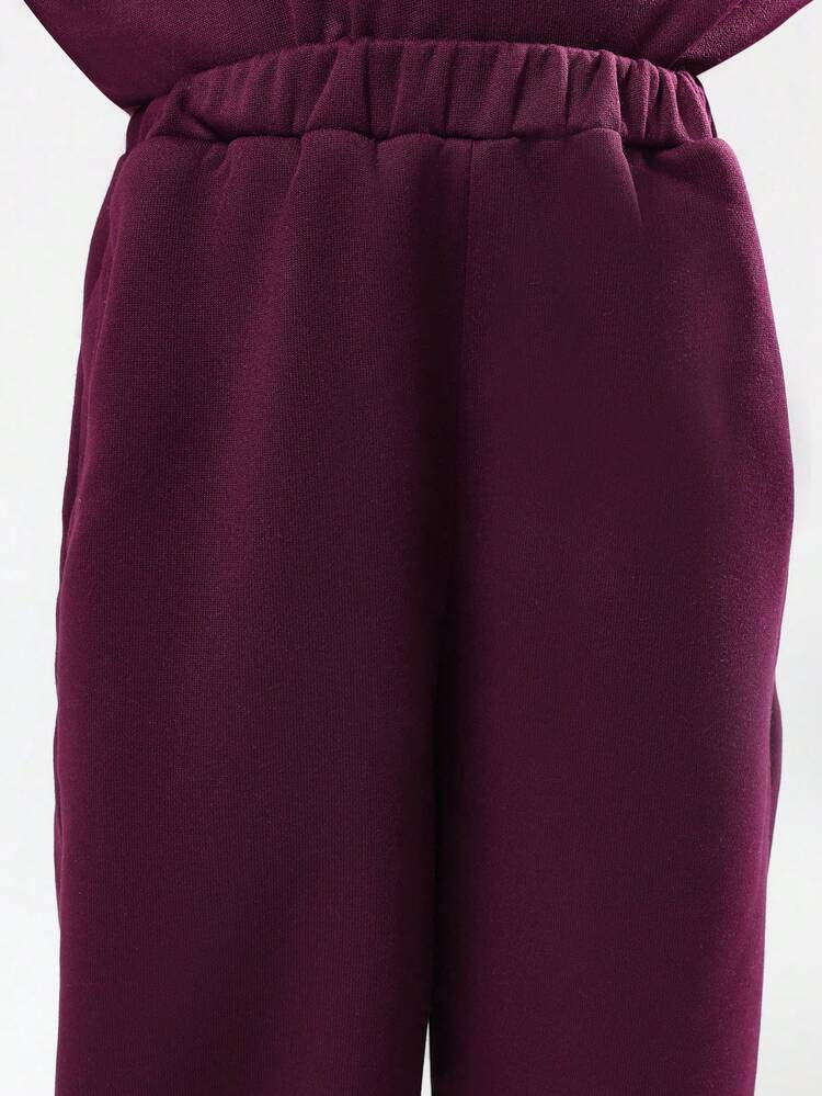 Completo composto da felpa e pantaloni a gamba larga in due pezzi