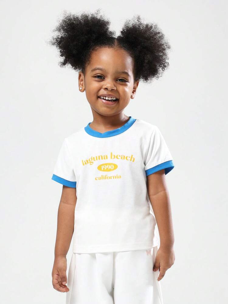 노란색 프린트가 있는 흰색 코튼 링거 티셔츠