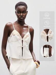 Lumivelle Women's Apricot Spaghetti Strap Bralette Cami Top Featuring An Alluring Knot Front And Elegant Embroidered Details. This Regular Length, Top Is Ideal For Stylish Party Wear. Clothes For University - Apricot - View 1