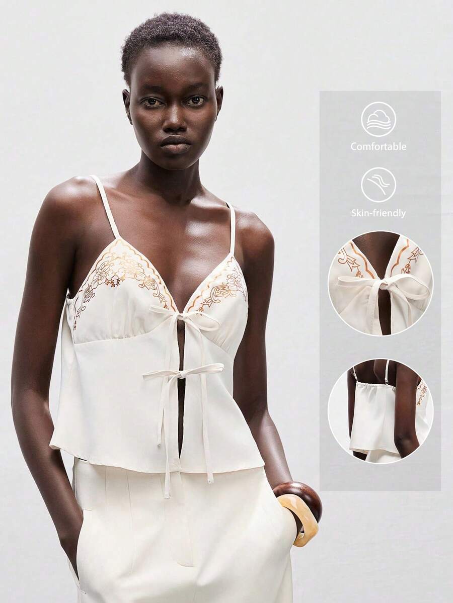 Lumivelle Women's Apricot Spaghetti Strap Bralette Cami Top Featuring An Alluring Knot Front And Elegant Embroidered Details. This Regular Length, Top Is Ideal For Stylish Party Wear. Clothes For University - Apricot - View 1