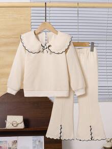 少女甜美可爱长袖彼得潘领卫衣搭配杏色喇叭裤套装，时尚简约通勤秋冬