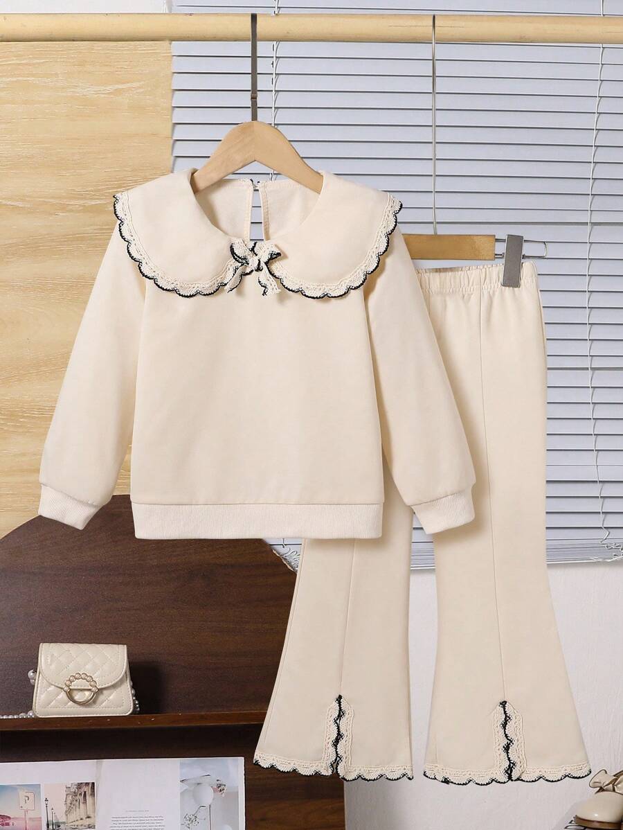 少女甜美可爱长袖彼得潘领卫衣搭配杏色喇叭裤套装，时尚简约通勤秋冬
