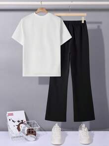 SHEIN Bộ 2 món/Bộ áo ngắn tay thường ngày và quần ống loe cho bé trai tuổi teen, trang phục phong cách trường học Punk Rock đường phố cho hàng ngày, tiệc tùng, lễ hội âm nhạc, thích hợp cho mùa xuân/hè, tương phản đen trắng theo phong cách Gothic Anh - Đen và trắng - Xem 2