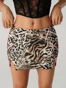 SHEIN ICON Jupe mini moulante femme style boho vintage pour sortie sexy et vacances. Imprimé patchwork léopard et tigre, avec nœud décoratif et fente à l'ourlet. Jupe d'été imprimé animal
