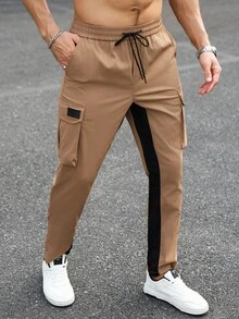 Manfinity LEGND Męskie spodnie casualowe w kontrastowym kolorze ze ściągaczem w pasie i kieszeniami cargo, jesień - Kolor khaki - Zobacz 1