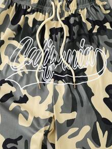 PAVTROS Tween Boy Camo & Letter Graphic Striped Trim Drawstring Waist Shorts