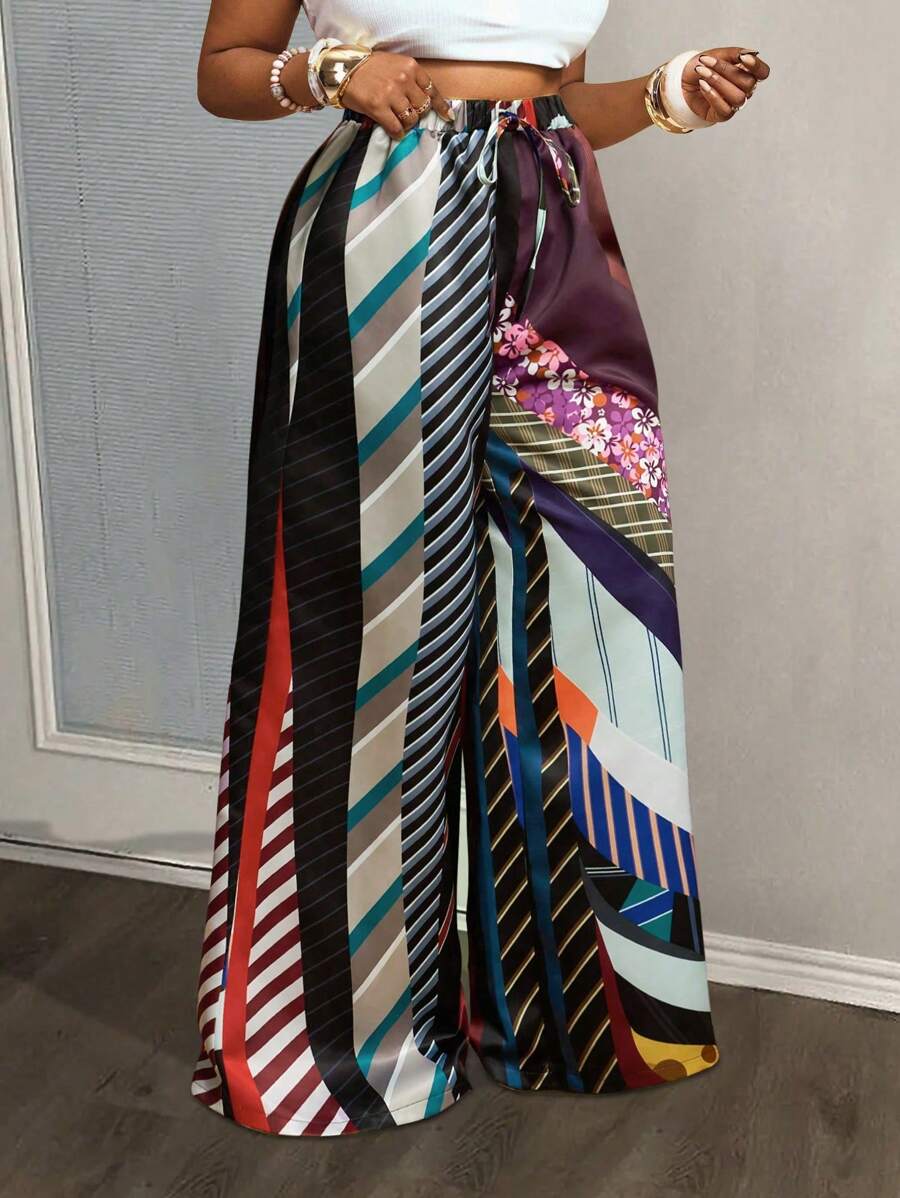 Slaydiva Pantalon évasé ample pour femmes grandes tailles, collection Printemps-Été 2025. Présentant un imprimé tie-dye sur tissu satiné pour le streetwear, les sorties casual, les fêtes et les rassemblements sociaux