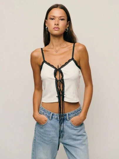  Nöista White Lace-Up Cami With Black Trim, Giving Corset-Inspired Detail For Fall Tops Women. Perfect Styled For Goth Or Alternative Looks, Versatile For Cosplay, And Chic For Halloween Parties Or Layered Fall Outfits.