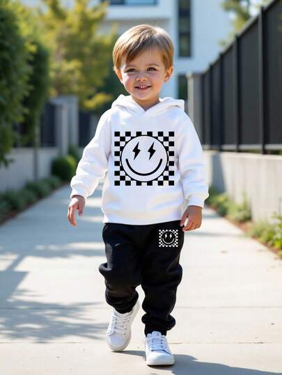 SHEIN Conjunto informal de 2 piezas de sudadera y pantalones holgados y cómodos con letras inglesas y gráficos en estilo deportivo para niños pequeños, adecuado para otoño/invierno