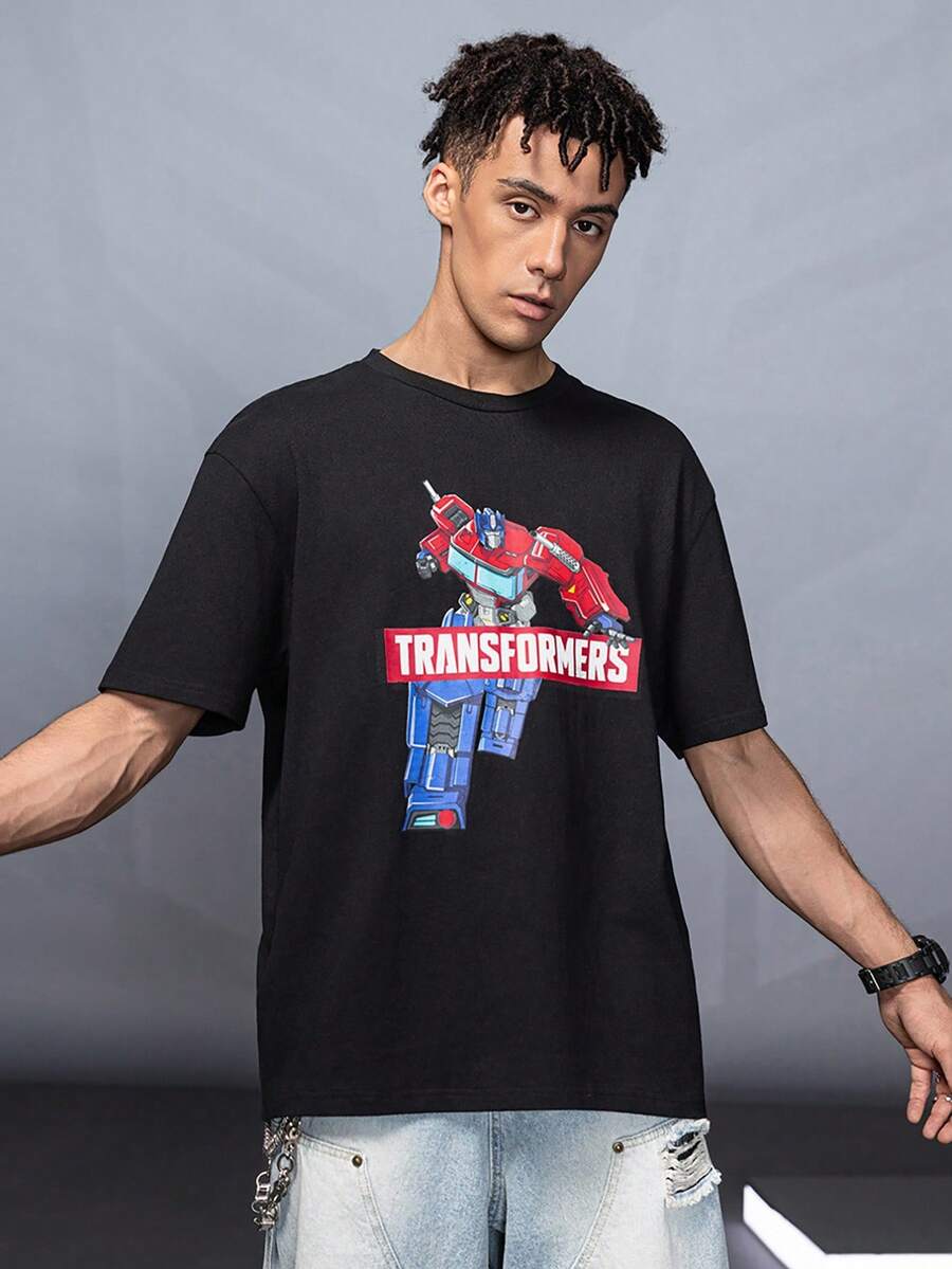 Transformers X SHEIN تي شيرت رجالي أسود بياقة مستديرة وأكمام قصيرة بطبعة روبوت - الأسود - مشاهدة 1
