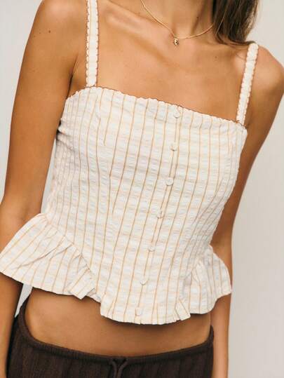 Nöista 象牙白色束身衣上衣，饰有精致细条纹、结构感鲸骨、宽肩带和柔软的荷叶边下摆。其优雅、结构化的设计和现代、别致的细节，是搭配个性和复古风格服装的理想之选。