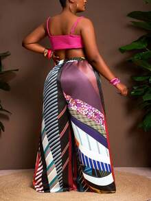 Slaydiva Pantalon évasé ample pour femmes grandes tailles, collection Printemps-Été 2025. Présentant un imprimé tie-dye sur tissu satiné pour le streetwear, les sorties casual, les fêtes et les rassemblements sociaux