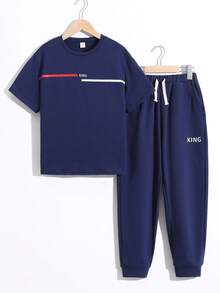 若い男性用 カジュアル&シンプルなレタープリント 半袖Tシャツ パンツセット 2点、ゆったりとした着心地で、外出、学校、バケーション、パーティー、スポーツ、春夏に最適 - ロイヤルブルー - チェックする 1