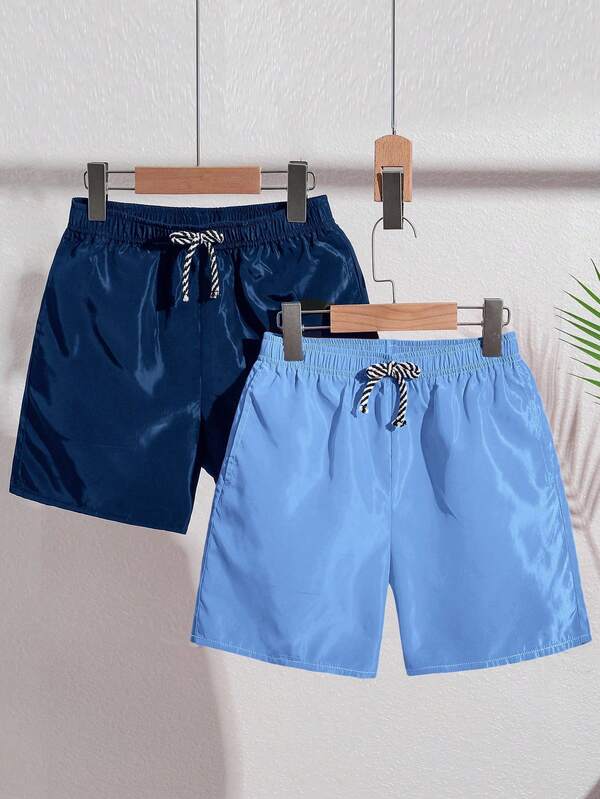 SHEIN 2pcs/Set Tween Boys' Solid Color Loose Woven Casual Beach Swim Trunks, 2 Colors