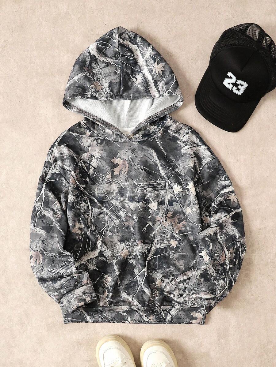 SHEIN بلوزة رياضية كاجوال فضفاضة للمراهقات بطبعة كاموفلاج أشجار وأغصان وطباعة شارع مع كابوشون