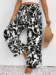SHEIN Frenchy Pantalones sueltos casuales informales de talle alto con nudo, estilo de festival de música, estampado de flores negras pequeñas y degradado, para vacaciones, talla grande - Blanco y Negro - Ver 1