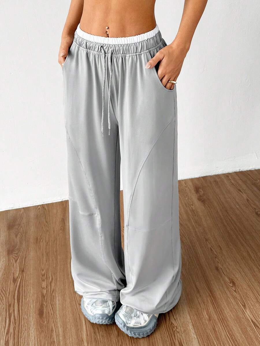 Dewbera Pantalon de yoga large avec poches pour femmes, design minimaliste - Gris - Voir 1