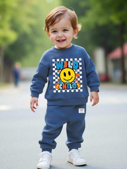 SHEIN 年轻男孩休闲宽松舒适英文字母可爱卡通街头风格图形圆领运动衫和裤子两件套，适合秋冬