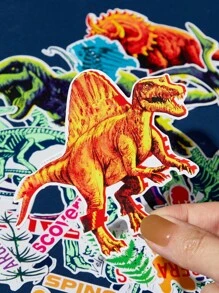 Discovery X SHEIN 42张卡通图案贴纸套装，适合学生、男士和女士，可用于笔记本、日记本、工艺品等物品。也可用于个性化滑板、笔记本电脑和行李箱。可移除背胶，易于撕除不留残胶，图案包括恐龙和霸王龙。