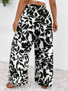 SHEIN Frenchy Pantalones sueltos casuales informales de talle alto con nudo, estilo de festival de música, estampado de flores negras pequeñas y degradado, para vacaciones, talla grande - Blanco y Negro - Ver 2