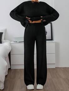 EURMUSE Due pezzi di set lavorato a maglia consumato, con maglione a spalle scoperte con orlo sfilacciato e pantaloni a zampa larga con costine in nero - nero - Visualizzare 2