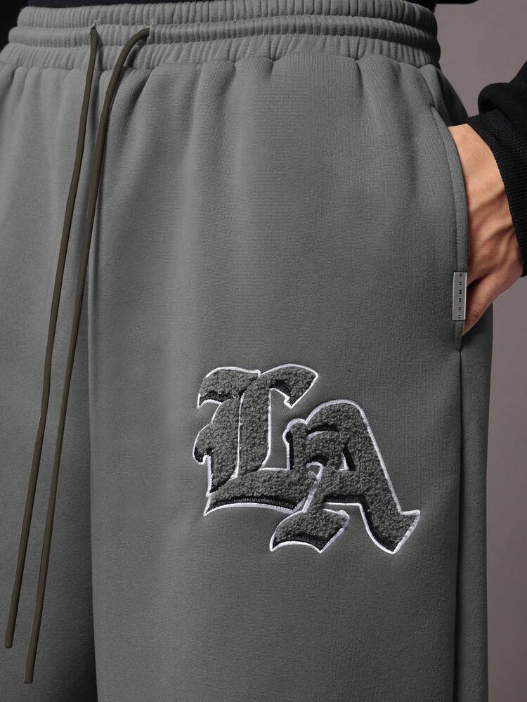 Essential Drop Crotch Joggers With Logo Patch And Drawstring
