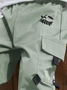 SHEIN 青少年男童休闲运动图案印花口袋宽松抽绳工装裤，适合通勤、上学、日常休闲、旅行、运动、春夏秋冬