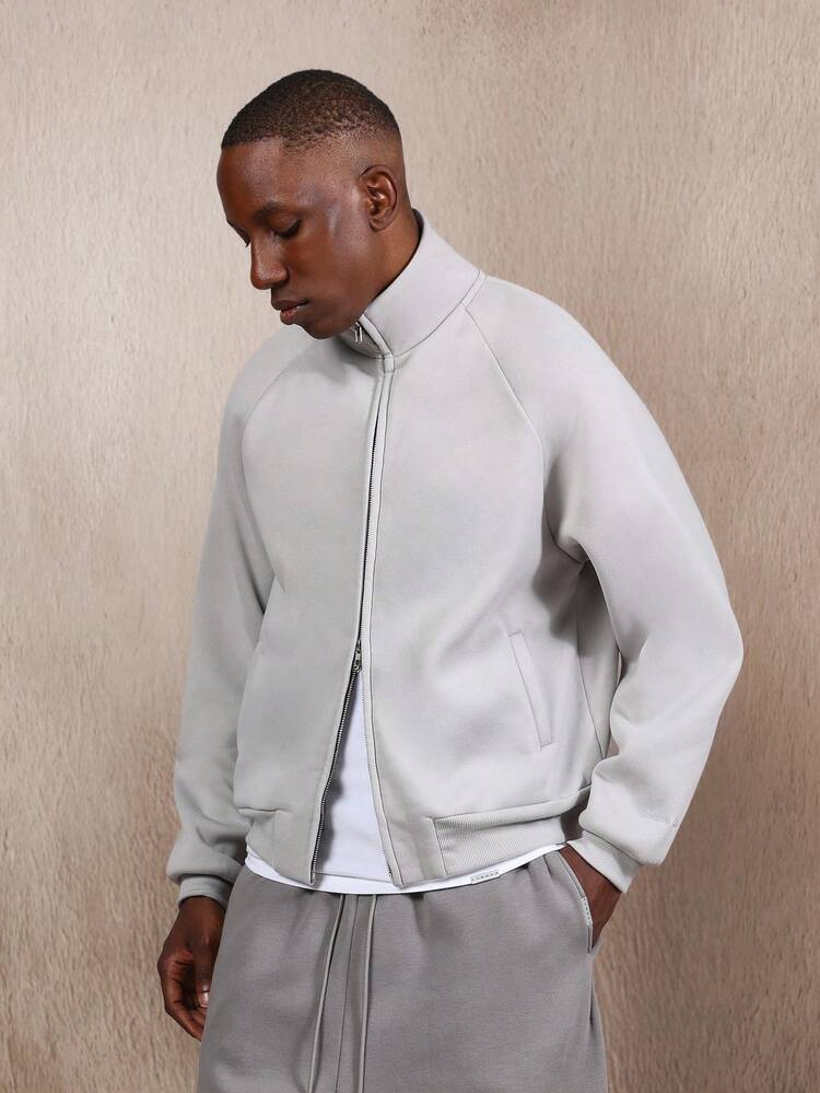 Kurtka z grubej dzianiny z suwakiem i ściągaczami przy mankietach