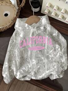 SHEIN Áo nỉ rộng rãi phong cách rằn ri bờ biển phía Tây California dành cho bé gái tuổi teen, mùa thu 2025, mùa tựu trường, áo nỉ dài tay cổ tròn dáng rộng thoải mái, phù hợp cho mùa thu/đông, áo nỉ rằn ri phong cách cá tính. - Nhiều màu - Xem 2