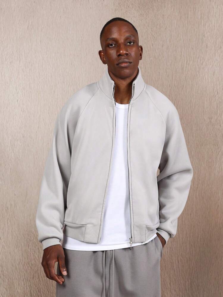 Kurtka z grubej dzianiny z suwakiem i ściągaczami przy mankietach