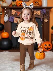 SHEIN Bộ đồ 2 món Happikins màu trắng kem in hình bí ngô và nơ dễ thương, áo nỉ dài tay dáng rộng thoải mái và quần skinny, thích hợp cho mùa thu/đông, chủ đề bí ngô Halloween, trang phục mùa thu, thoải mái dễ chịu, đồ nhiều lớp mùa thu cho bé gái, phong cách thời trang cho bé gái, trang phục thường ngày, quần áo in hình cho bé gái, trang phục mùa thu. - Nhiều màu - Xem 3