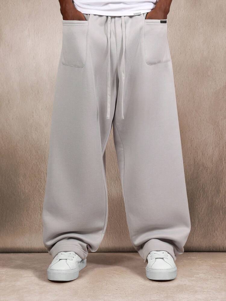 Spodnie dresowe Essential Loose Fit Baggy z kieszeniami naszywanymi i ściągaczem