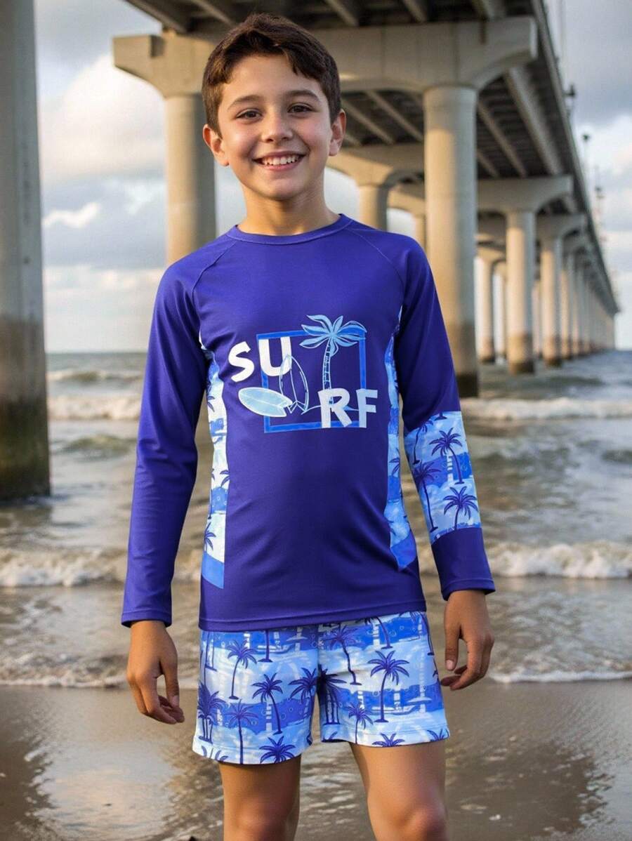 SHEIN 2pcs Tween Boys Swimsuit Set-Tropical Holiday Print Short Sleeve Rash Guard Top And Swim Trunks Shorts, Suitable For Vacation Pool Play Boy Set Long - Navy Blue - View 1