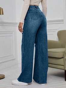 Jeans de pierna ancha con cintura alta y rotos en azul denim lavado