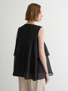 FRIFUL Camiseta casual versátil de mujer de color negro sólido con cuello redondo, sin mangas y con ribete de volantes