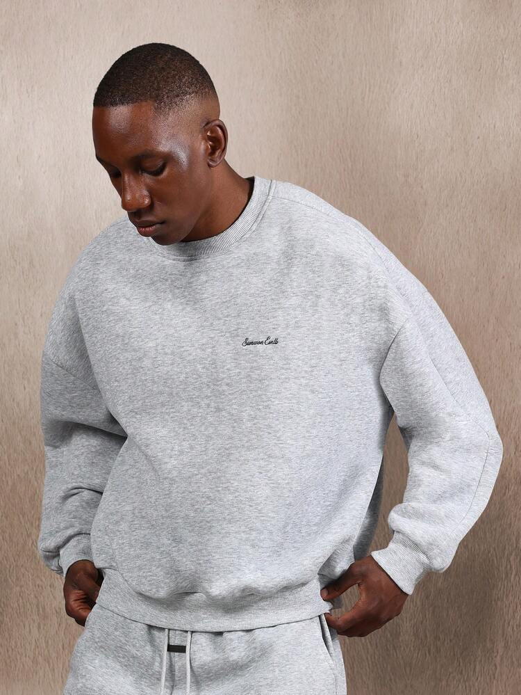 Felpa girocollo oversize con trama mélange