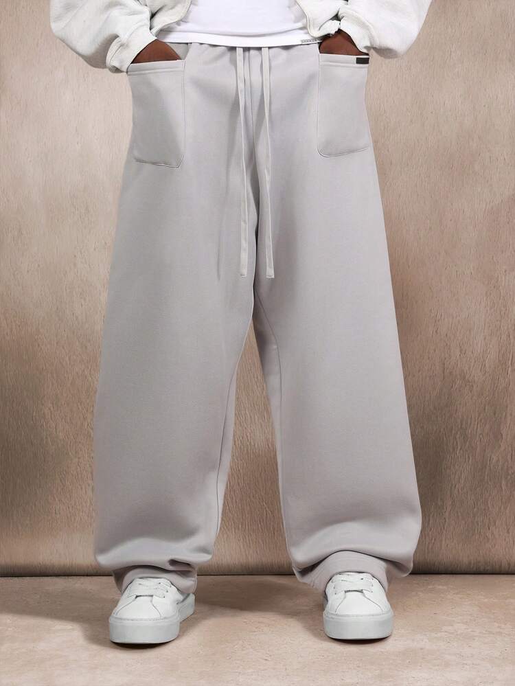 Spodnie dresowe Essential Loose Fit Baggy z kieszeniami naszywanymi i ściągaczem