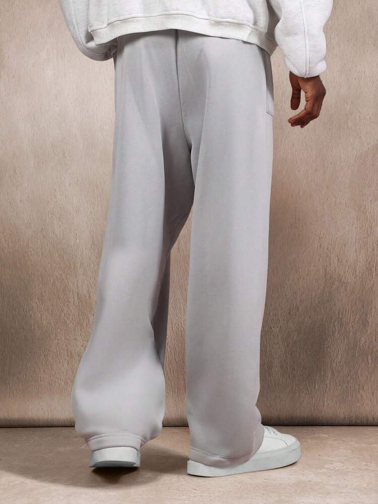 Spodnie dresowe Essential Loose Fit Baggy z kieszeniami naszywanymi i ściągaczem