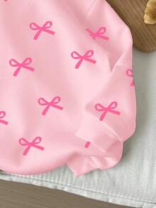 Sudadera de punto suave de manga larga con cuello redondo, cómoda y de corte holgado, con estampado de lazos, para niñas jóvenes de uso diario